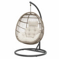 Fauteuil suspendu de jardin 105 x 95 x 195 cm résine tressée PE taupe acier gris avec support base circulaire coussins crème